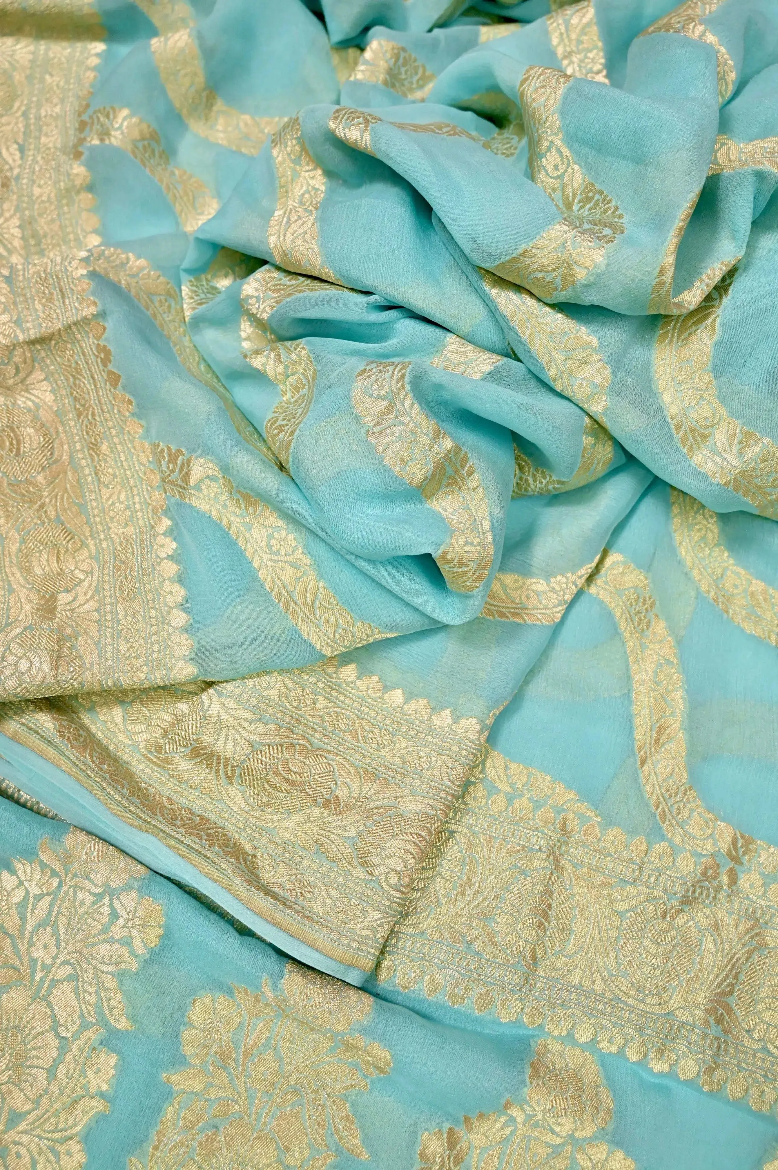 Light Blue Color Pure Georgette Banarasi Saree with Leheriya Pattern Zari Work